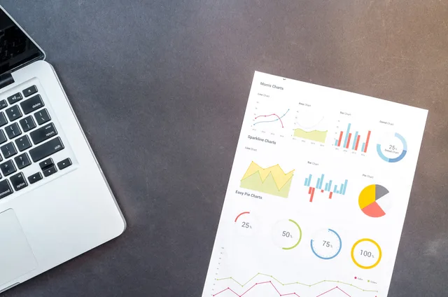 Modern desk setup with a laptop and analytical charts showcasing data interpretation and business analysis. How to run an SEO tools launch review using named sources